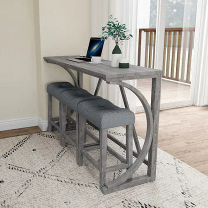 The Apex Artisan Bar Ensemble displayed in an elegant interior, featuring a solid wood rectangular table paired with plush light grey upholstered stools, perfect for refined dining or workspace.