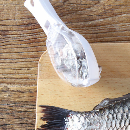 Fish Skin Brush - Close-up of the stylish fish scaler in action, demonstrating its efficient and mess-free fish scaling capabilities on fresh fish.