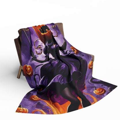 Elegant decorative and warm Halloween spooky Arctic fleece blanket hanging over a chair, adorned with a stunning Halloween motif, ideal for seasonal comfort.