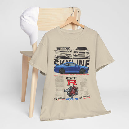 Luxurious beige Nissan Skyline GT-R T-Shirt displayed on a wooden chair with a baseball cap, featuring iconic GT-R artwork and technical specifications, perfect for automotive enthusiasts.