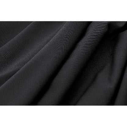 Model wearing the Dark in Love Keziah High Waisted Skirt styled with a petticoat, highlighting the voluminous bat wings hem for an elegant and playful look.