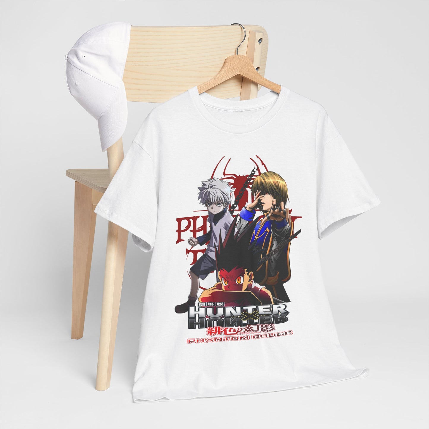 Stylish presentation of the Hunter x Hunter T-shirt draped over a chic wooden chair, paired with a white cap, exuding modern elegance and anime-inspired fashion.