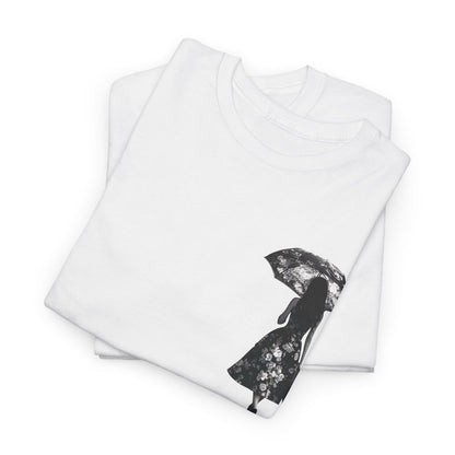 Luxurious Duality Dreams Unisex T-Shirt folded neatly in white, displaying a delicate floral design featuring a silhouette of a woman with an umbrella, merging style and creativity for a unique fashion statement.