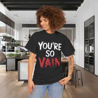 You’re So Vain Graphic T-Shirt displayed on a model in a modern kitchen, showcasing a stylish urban unisex design.