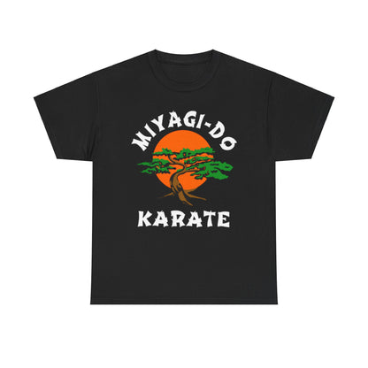 Exquisite graphic T-shirt featuring the Miyagi-Do Karate logo, designed for fans of martial arts and the Cobra Kai series. This stylish unisex tee showcases a vibrant tree design against a striking orange sun backdrop, blending comfort and elegance. Perfect for casual outings or as a statement piece, it embodies the spirit of resilience and camaraderie in martial arts.