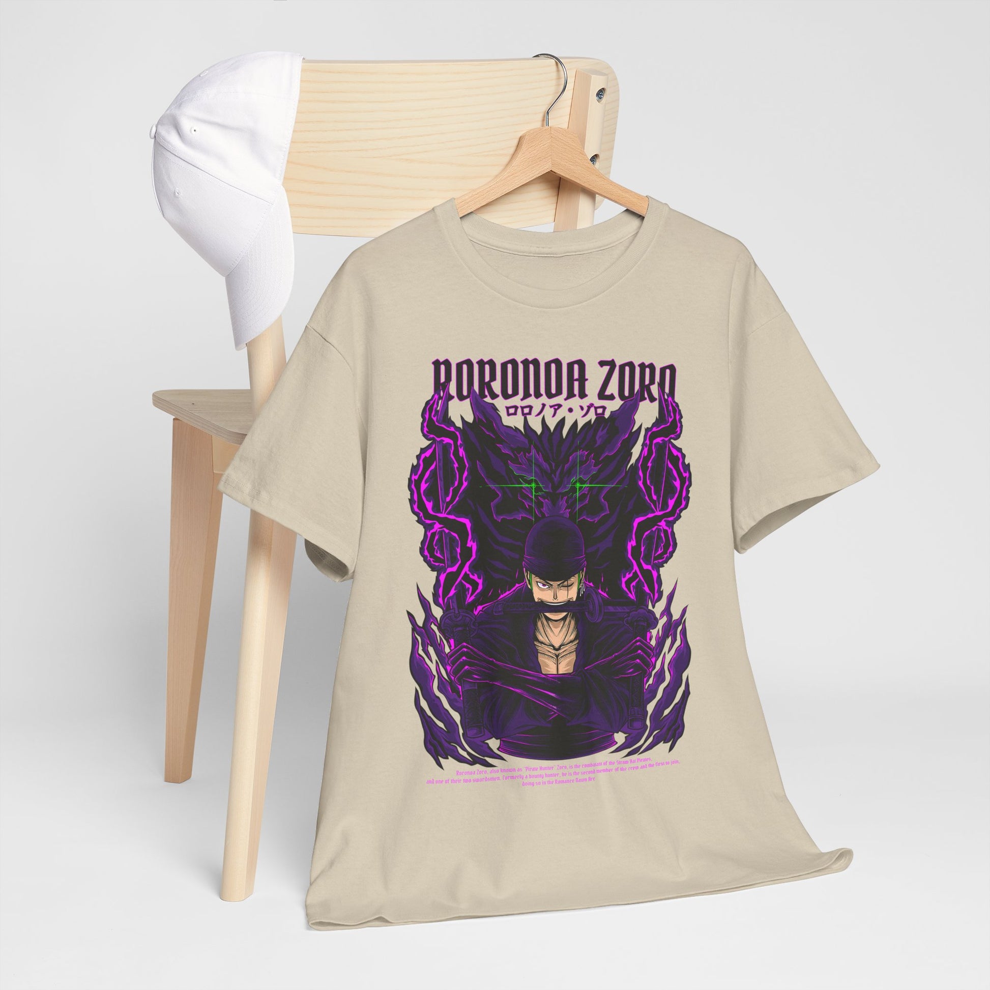 Fashionable Roronoa Zoro graphic tee styled on a chair alongside a white cap, showcasing the unique design that celebrates anime culture with elegance.