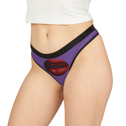 Elegant women's thong featuring a playful graphic design of shimmering red lips on a purple background, ideal for romantic occasions such as Valentine's Day or anniversaries.