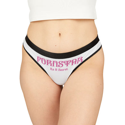Exquisite women's cheeky thong panties featuring the provocative graphic "PORNSTAR: It’s a Secret" in elegant typography, designed for comfort and allure and showcased against a fashionable black and white background.