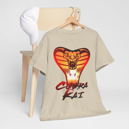 Chic Cobra Kai t-shirt elegantly styled with a baseball cap on a wooden chair, featuring a striking snake logo that epitomises martial arts culture.