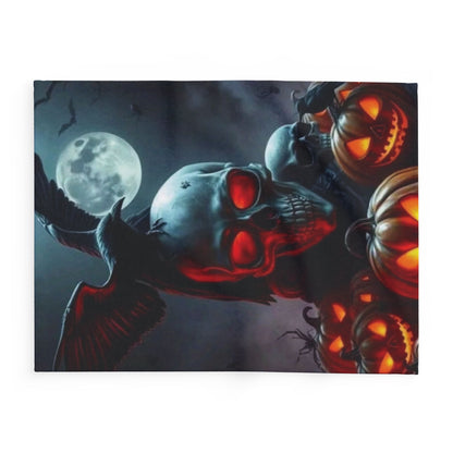 Sumptuous Halloween Arctic fleece blanket featuring a dramatic depiction of a skull, illuminated pumpkins, and a raven, designed to enhance your autumn decor with a luxurious flair.