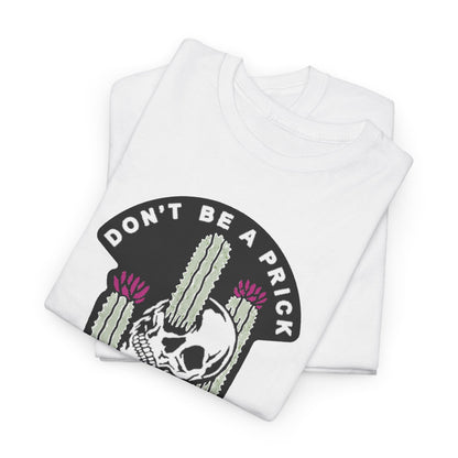 Sumptuous white t-shirts elegantly folded, featuring the distinctive skull and cactus graphic with the phrase 'DON'T BE A PRICK', embodying a trendy aesthetic.