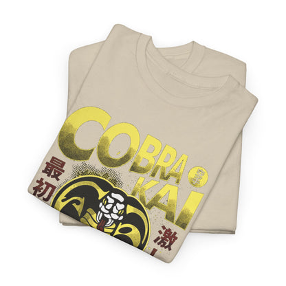 Luxurious fold of a unisex Cobra Kai T-shirt featuring bold graphics and the revered Cobra design, ideal for those who appreciate martial arts and refined humour.
