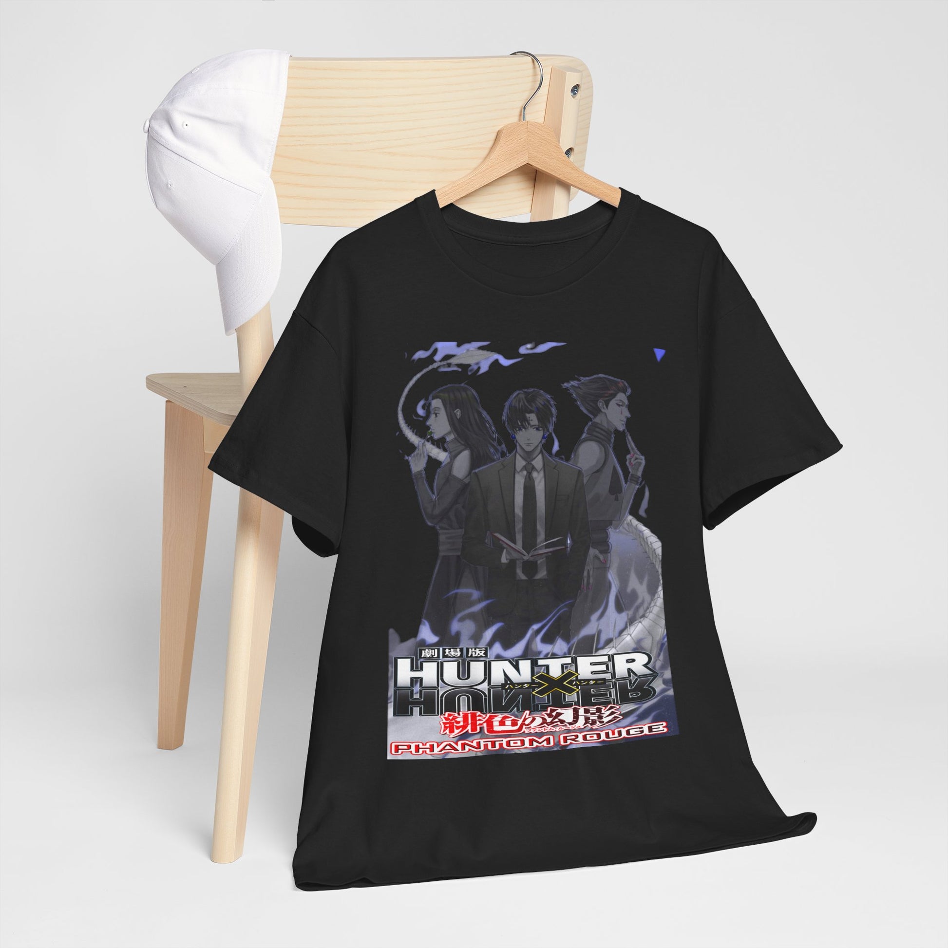 Chic presentation of a Hunter x Hunter Phantom Rouge T-shirt paired with a white cap, hanging on a wooden chair, emphasizing a trendy anime-inspired style.