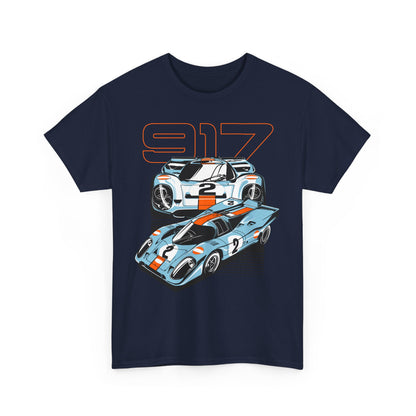 Stylish navy blue t-shirt featuring an artistic design of two Porsche 917 race cars, showcasing vintage racing style with striking orange accents.