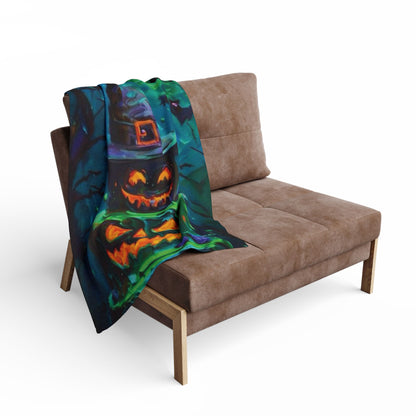 Decorative and Warm Halloween Spooky Arctic Fleece Blanket draped over a modern sofa, featuring bright pumpkin art that enhances autumnal charm and provides cosy comfort.