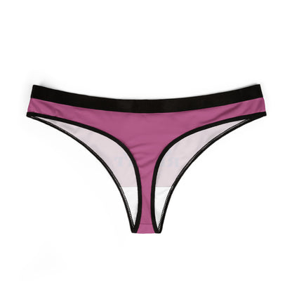 Luxurious women's thong in vibrant purple and black, featuring bold text 'TREAT YOUR GIRL RIGHT'. Elegant design perfect for playful intimates.