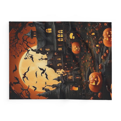 Decorative and Warm Halloween Spooky Arctic Fleece Blanket showcasing a mystical illustration of a haunted mansion with playful pumpkins and bats, elevating your Halloween ambience with its luxurious design.