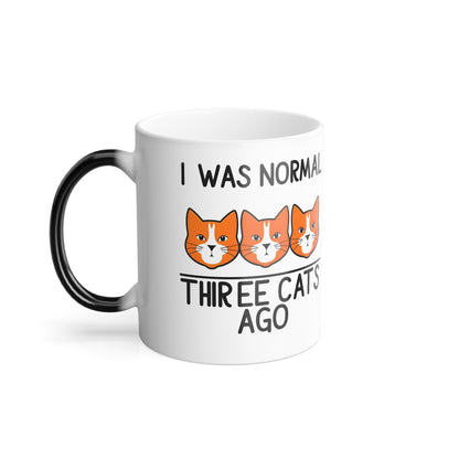Sophisticated view of the "I Was Normal 3 Cats Ago" Colour Morphing Mug featuring adorable orange cats, a must-have gift for discerning cat lovers.