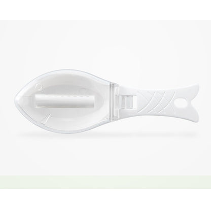 Fish Skin Brush - Pristine white fish scaler captured against a minimalistic backdrop, emphasising its sophisticated design and practical features for gourmet cooking.
