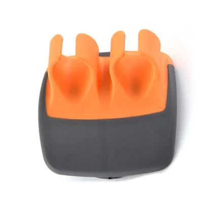 Elegant ergonomic kitchen accessory in striking orange and sophisticated black, perfectly crafted for seamless peeling of fruits and vegetables.