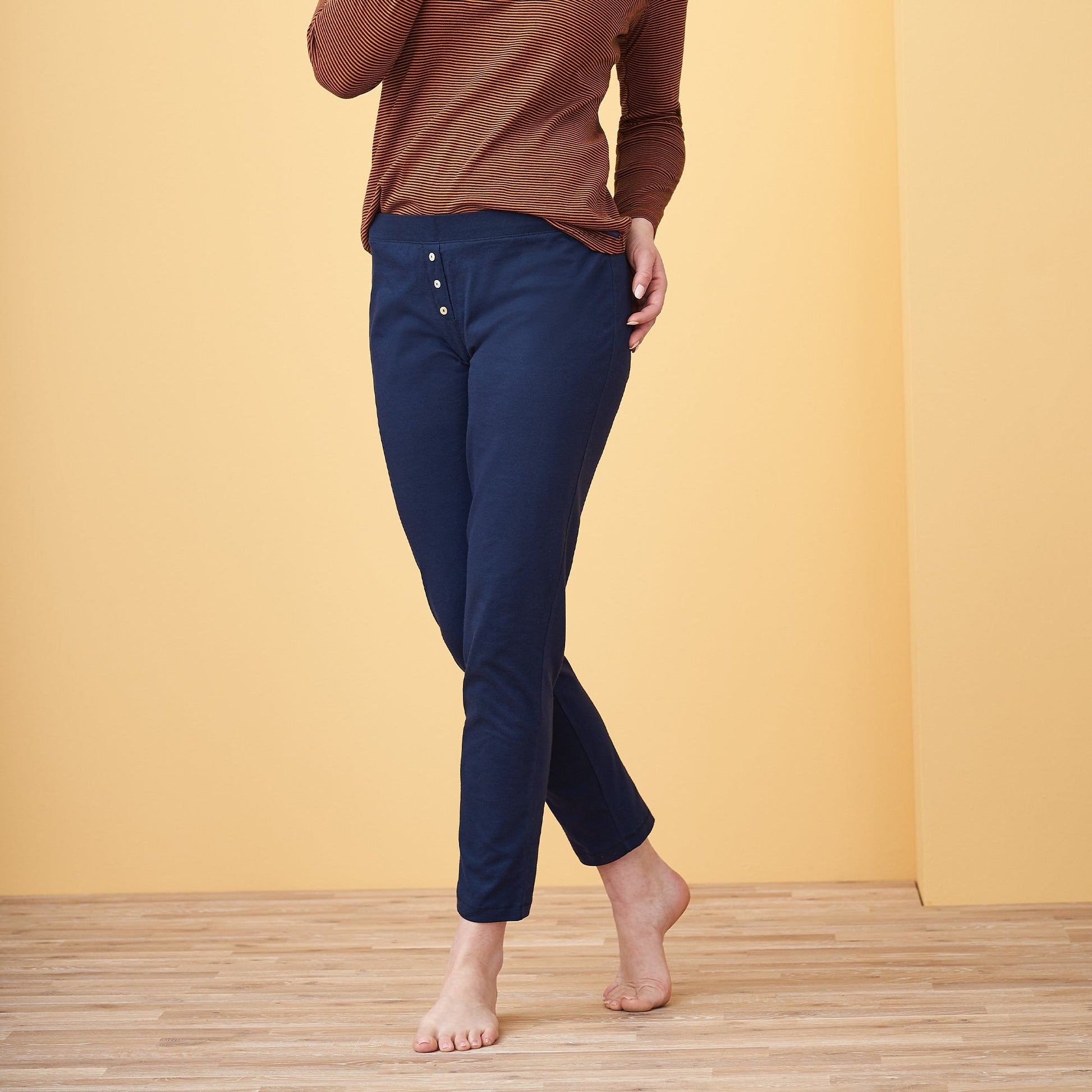 Luxury organic cotton sleep leggings for women, showcasing elegant mother-of-pearl buttons and a comfortable fit, designed for restful nights.