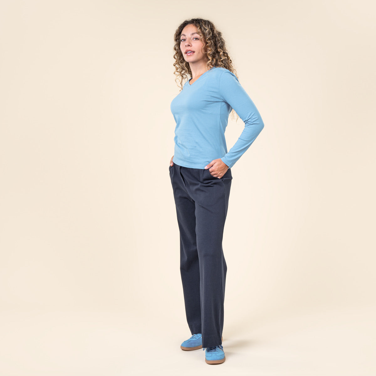 Elegant luxury organic cotton long sleeve V-neck top for women by Earth Wardrobe, showcasing a modern and comfortable fit.