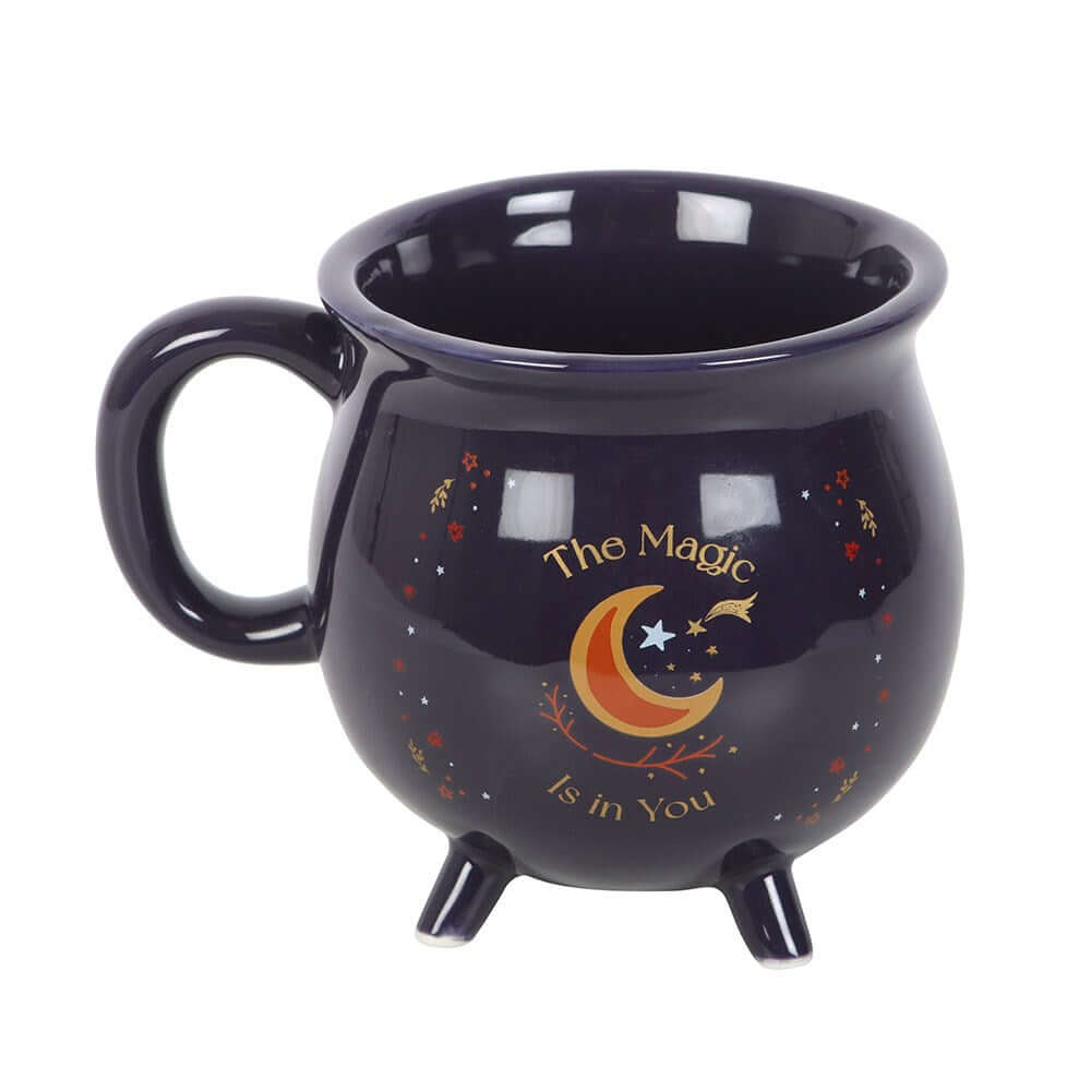 Luxurious midnight-blue cauldron mug featuring golden stars and crescent moon, perfect for enchanting coffee and tea rituals.