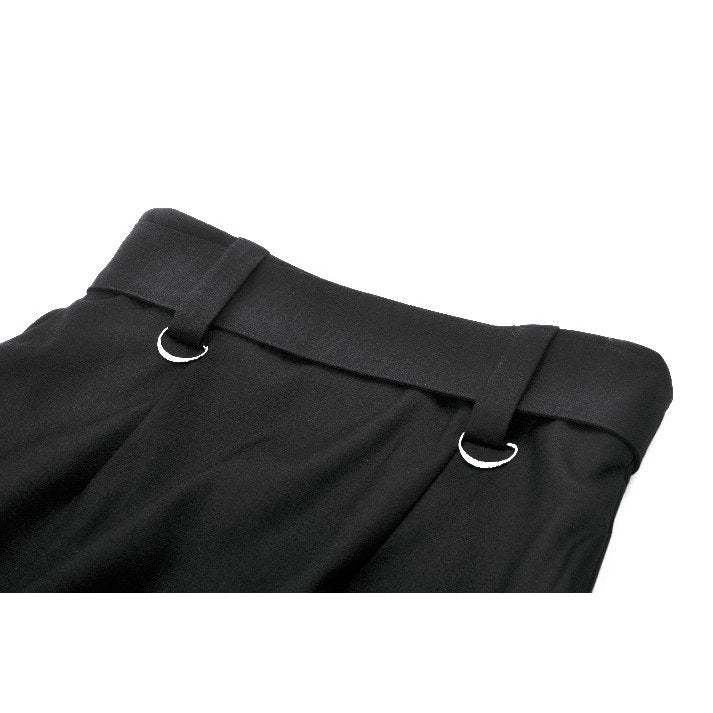 Model wearing the Dark in Love goth skirt with split front layers, exuding confident style at a gothic event, showcasing its flattering silhouette and bold design.