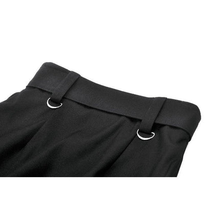 Model wearing the Dark in Love goth skirt with split front layers, exuding confident style at a gothic event, showcasing its flattering silhouette and bold design.