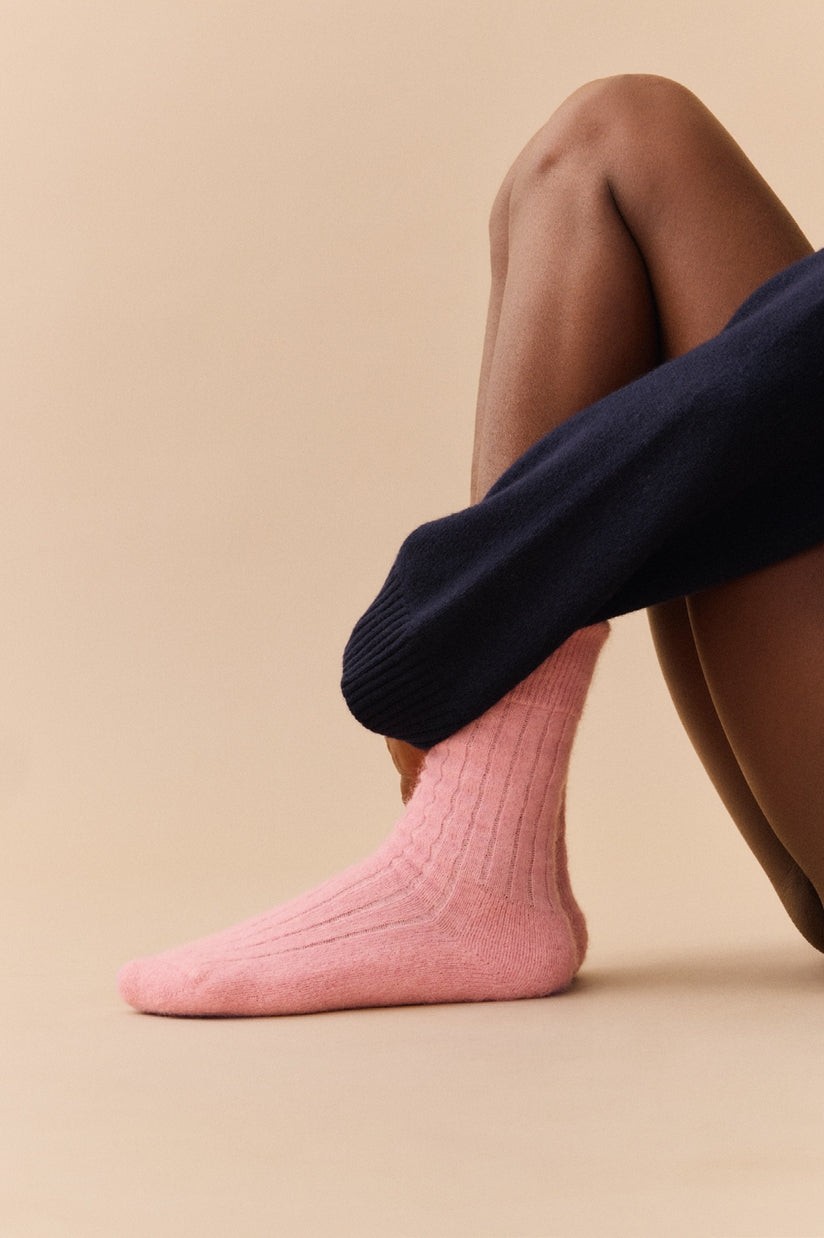 Cozy and elegant alpaca ribbed bed socks, featuring a plush cushioned sole, designed for luxurious warmth and comfort.