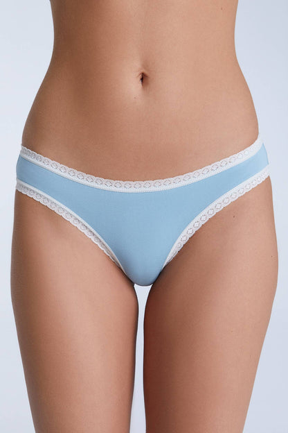 Close-up view of organic cotton women's briefs with delicate lace trim, highlighting the quality and softness of the fabric.