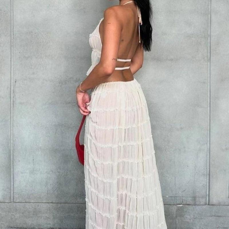 Elegant women's sleeveless backless halter top and pleated long skirt ensemble, available in various colours, perfect for summer occasions.
