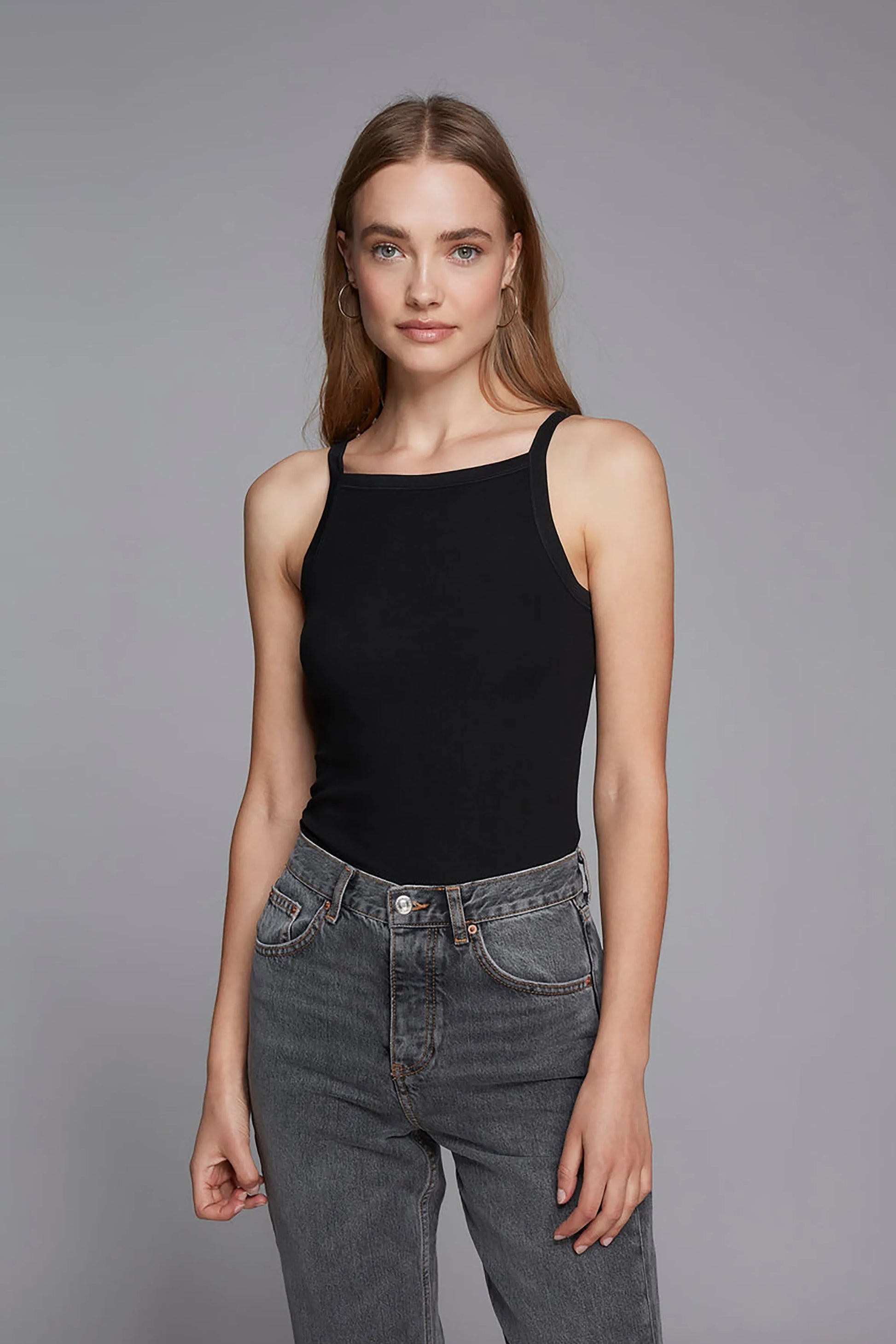 Luxurious women's high neck tank top in soft TENCEL™ Lyocell, perfect for stylish layering.