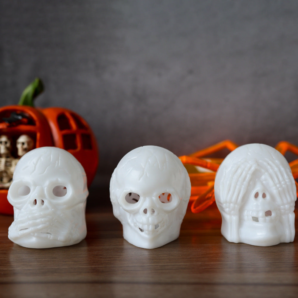 Halloween Skull Light - A luxurious display of three white skull lamps against a backdrop of seasonal decorations, combining elegance with a playful Halloween spirit.