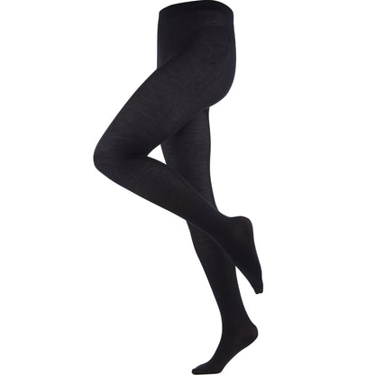 Stylish women's tights in a chic setting, embodying luxury with sustainable organic wool and cotton.