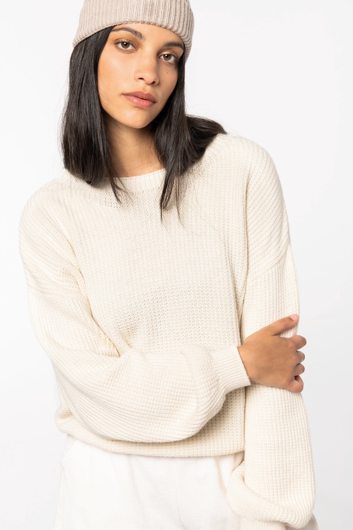 Model wearing a luxurious merino wool and organic cotton jumper, exemplifying comfort and sophistication in women’s fashion.