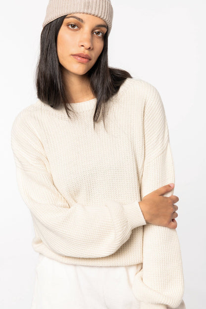 Model wearing a luxurious merino wool and organic cotton jumper, exemplifying comfort and sophistication in women’s fashion.