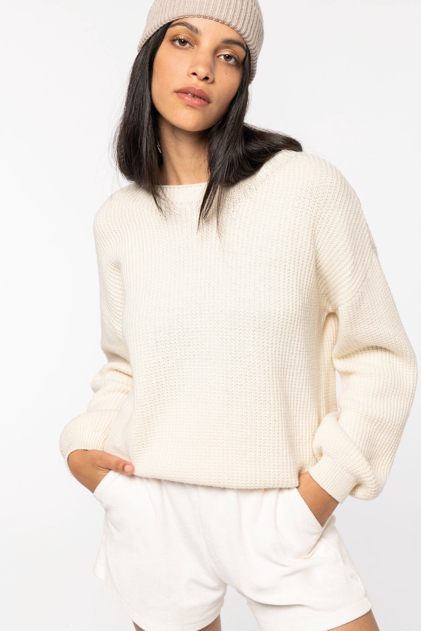 Close-up of soft organic cotton and merino wool blend, highlighting the luxurious texture of the women’s jumper.