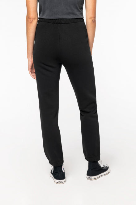 Close-up of the eco-conscious jog pants made from soft brushed-back fleece, highlighting the elegant elasticated waistband and contemporary casual design.