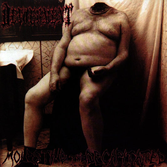 Officially licensed CD of 'Molesting The Decapitated' by Devourment, featuring luxury-quality packaging and produced by Rancid Offal Records, perfect for death metal enthusiasts.