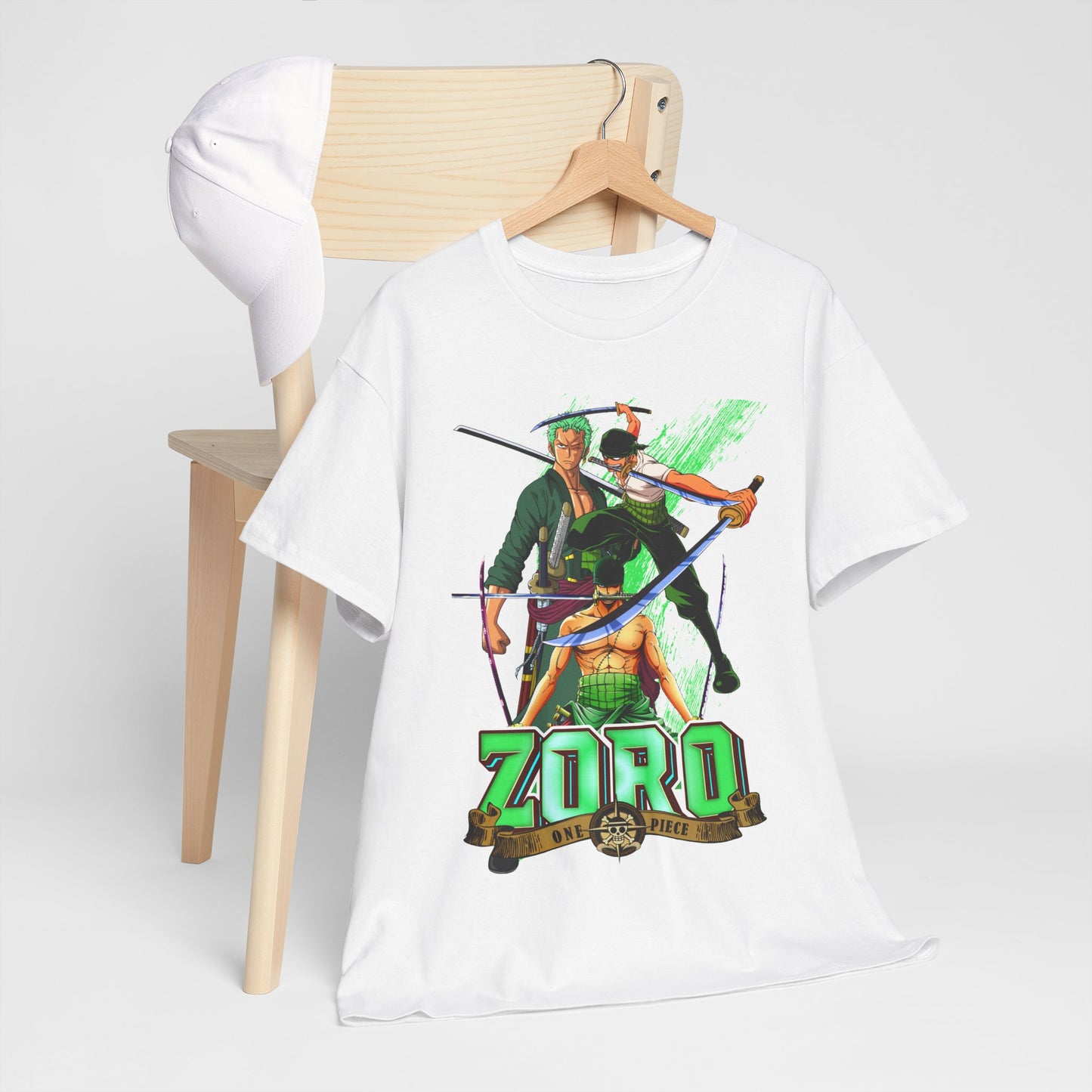 Chic arrangement of a One Piece Zoro t-shirt draped over a wooden chair, paired with a stylish cap, epitomising modern anime fashion.