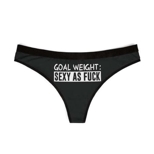 Chic black thong with striking white text stating 'GOAL WEIGHT: SEXY AS F***', perfect for adding a touch of cheeky luxury to intimate moments.