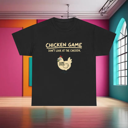 Urban Chicken Game Graphic T-Shirt in elegant black, displaying whimsical chicken artwork with ‘CHICKEN GAME, DON’T LOOK AT THE CHICKEN.’ Indulge in stylish luxury with this 100% cotton unisex tee.