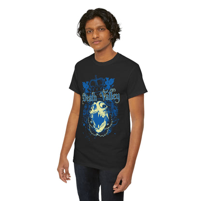 A fashionable young man showcasing a black t-shirt decorated with a vibrant blue skull and intricate design, symbolising bold sophistication.