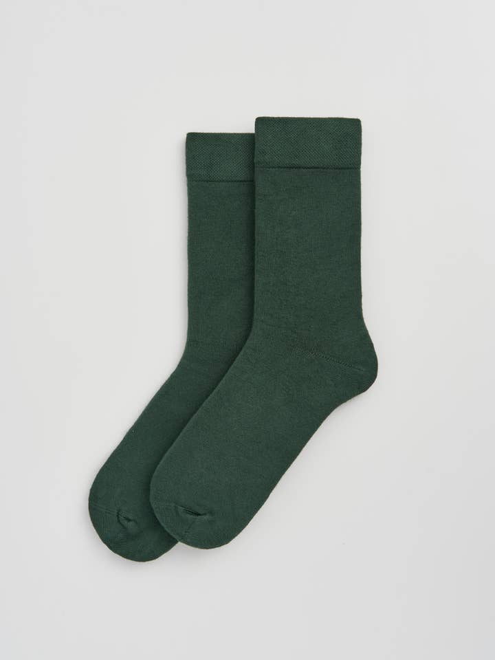 Stylish bamboo calf-length socks in a sophisticated setting, emphasizing their versatility and moisture-wicking functionality.