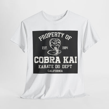 Luxury unisex graphic t-shirt featuring a Cobra Kai design. The shirt showcases a prominent black and white print that reads 'Property of Cobra Kai, Est. 1984, Karate Do Dept, California', ideal for martial arts enthusiasts and fans of the Cobra Kai series, blending style with a nod to karate heritage.