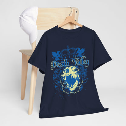 Navy blue t-shirt featuring a bold gothic skull and 'Death Valley' graphic, artfully hung alongside a casual white cap on a wooden chair.
