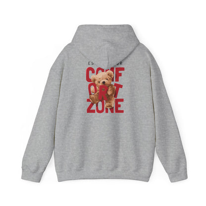 Stylish grey hoodie embellished with a bold message 'ESCAPE YOUR COMFORT ZONE', featuring a playful teddy bear graphic on the back.