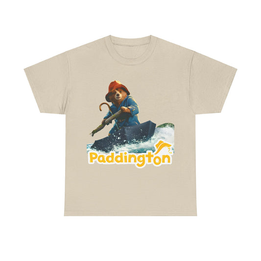 Paddington Bear in Peru Graphic Unisex T-Shirt – Premium Adventure Art Tee showcasing Paddington Bear on a stylish beige t-shirt, illustrating his whimsical adventure on a vibrant boat with bold lettering.