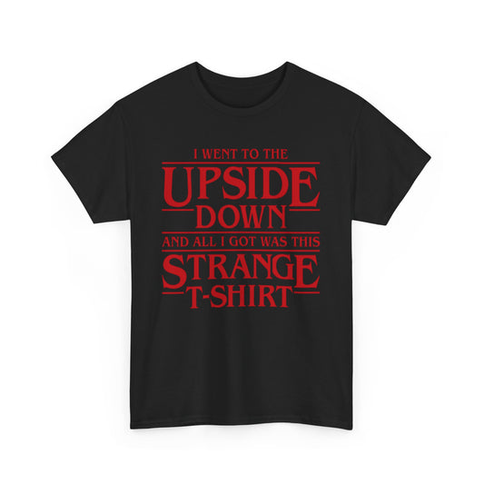 Elegant portrayal of the Stranger Things Unisex Graphic Tee, showcasing vibrant red lettering 'I WENT TO THE UPSIDE DOWN AND ALL I GOT WAS THIS STRANGE T-SHIRT' against a classic black fabric, ideal for stylish fans.